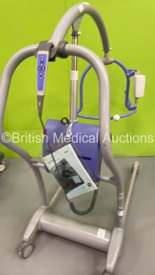 1 x Arjo Maxi-Twin Electric Patient Hoist with Battery and Controller (Powers Up), 1 x Marsden Wheelchair Weighing Scales and 1 x Anetic Aid Accessories Trolley - 4