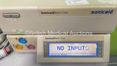 1 x Williams Medical Supplies Lamp on Stand and 1 x Sonicaid Team Duo Fetal Monitor with Sonicaid Team Care Printer and 4 x Transducers (Powers Up) - 2