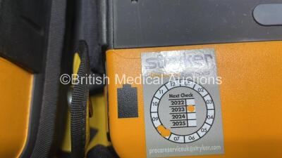 2 x Medtronic Physio Control Lifepak 1000 Defibrillators (Both Power Up, 1 x Small Crack In Casing - See Photos) with 2 x ECG Leads, 2 x Electrode Packs (Both in Date) and 2 x Batteries *Install Before 2024 / 2024* in Carry Cases - 3