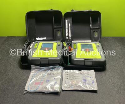 2 x Zoll AED PRO Defibrillators (Both Power Up) with 2 x 3 Lead ECG Leads, 2 x Batteries and 2 x Electrode Packs (Both In Date) in Carry Cases