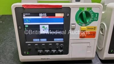 2 x Philips Heartstart XL+ Defibrillators (Both Power Up) Including Pacer, ECG and Printer Options with 1 x Battery - 2