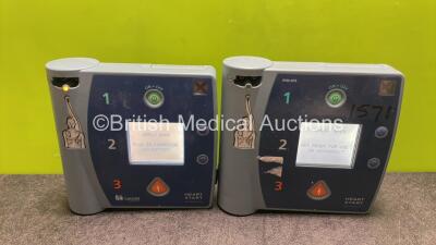 Job Lot Including 1 x Philips Heartstart FR2+ Defibrillator and 1 x Laerdal Heartstart FR2+ Defibrillator with 2 x Batteries (Both Power Up with Low Battery)