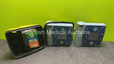 Job Lot Including 1 x Laerdal Heartstart FR2+ Defibrillator and 1 x Laerdal Heartstart FR2 Defibrillator with 2 x Batteries in 1 x Carry Case (1 x Powers Up, 1 x No Power, 1 x Flat Battery, 1 x Low Battery)