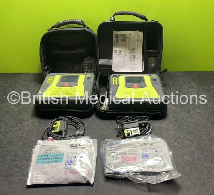 2 x Zoll AED PRO Defibrillators (Both Power Up) with 2 x 3 Lead ECG Leads, 2 x Batteries and 2 x Electrode Packs (1 In Date, 1 Expired) in Carry Cases