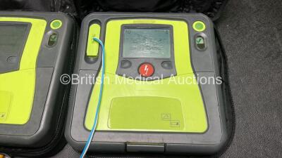 2 x Zoll AED PRO Defibrillators (Both Power Up with Damage to Screen - See Photos) with 2 x 3 Lead ECG Leads, 2 x Batteries and 2 x Electrode Packs (Both In Date) in Carry Cases - 4