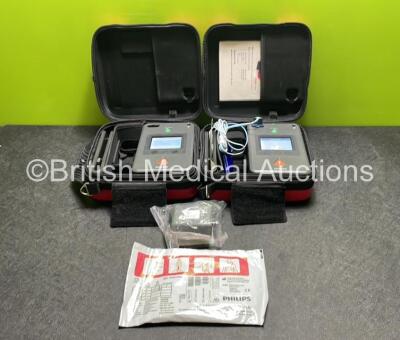 2 x Philips Heartstart FR3 Defibrillators (Both Power Up) In Carry Cases with 1 x Electrode Pack (In Date) and 3 x Batteries (Install Before NA / 2027 / 2026)