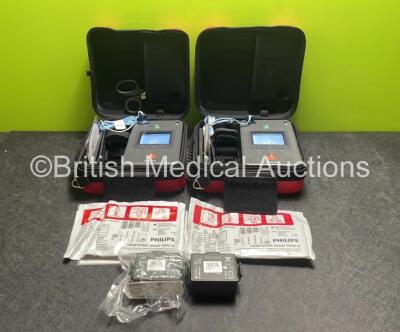 2 x Philips Heartstart FR3 Defibrillators (Both Power Up) In Carry Cases with 2 x Electrode Packs (1 In Date, 1 Expired) and 4 x Batteries (Install Before 2027 / 2025 / 2025 / 2023)