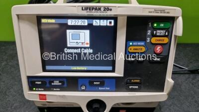 Medtronic Physio Control Lifepak 20e Defibrillator / Monitor (Powers Up, Slight Damage to Casing - See Photo) Including ECG, CO2 and Printer Options, 3 Lead ECG Lead, Paddle Lead, Test Load and Code Management Module *SN - 2