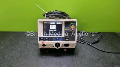 Medtronic Physio Control Lifepak 20e Defibrillator / Monitor (Powers Up, Door Missing) Including ECG, CO2 and Printer Options, 3 Lead ECG Lead, Paddle Lead and Code Management Module *SN 01334006*