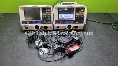 Job Lot Including 1 x Medtronic Lifepak 20e Defibrillator / Monitor (No Power, Damaged and Loose Casing - See Photo) Including Pacer, ECG, Printer Options and 1 x Medtronic Lifepak 20e Defibrillator / Monitor (Powers Up) , Damaged and Loose Casing - See P