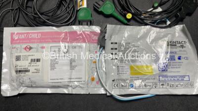 2 x Medtronic Physio Control Lifepak 1000 Defibrillators (Both Power Up with Cracks In Casing - See Photos) with 2 x ECG Leads, 2 x Electrode Packs (1 in Date, 1 Expired) and 2 x Batteries *Install Before 2025 / 2024* in Carry Cases - 6