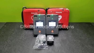 2 x Philips Heartstart FR3 Defibrillators (Both Power Up) In Carry Cases with 3 x Batteries *Install Before 2022 / 2021 / 2026 / 2025*