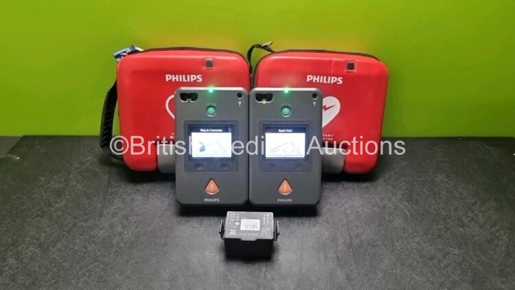 2 x Philips Heartstart FR3 Defibrillators (Both Power Up) In Carry Cases with 3 x Batteries *Install Before 2022 / 2027 / 2024*