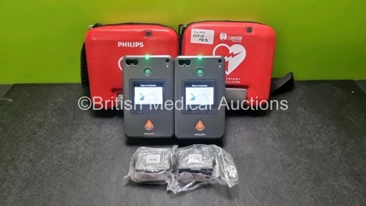 2 x Philips Heartstart FR3 Defibrillators (Both Power Up) In Carry Cases with 4 x Batteries *Install Before 2022 / 2023 / 2026*