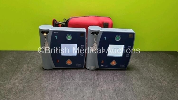 2 x Philips Heartstart FR2+ Defibrillators (Both Power Up) In 1 x Carry Case with 1 x Batteries *Install Before 2020 / 2023* and 1 x Philips Fast Response Kit