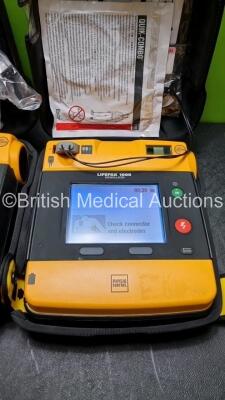 2 x Medtronic Physio Control Lifepak 1000 Defibrillators *Mfd 2013* (Both Power Up 1 x with Crack in Casing - See Photo) *SN 41245150 / 41245149* - 3