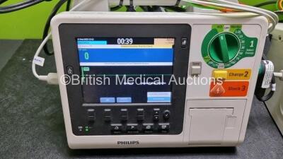 2 x Philips Heartstart XL+ Defibrillators (Both Power Up) Including Pacer, ECG and Printer Options with 2 x Paddle Lead, 2 x 3 Lead ECG Leads and 2 x Batteries - 2