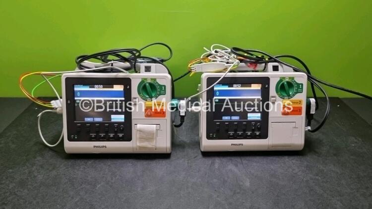 2 x Philips Heartstart XL+ Defibrillators (Both Power Up) Including Pacer, ECG and Printer Options with 2 x Paddle Lead, 2 x 3 Lead ECG Leads and 2 x Batteries