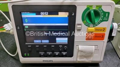 2 x Philips Heartstart XL+ Defibrillators (Both Power Up) Including Pacer, ECG and Printer Options with 2 x Paddle Lead, 2 x 3 Lead ECG Leads and 2 x Batteries - 2