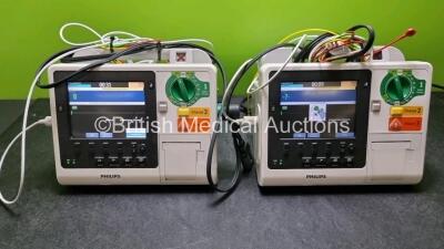 2 x Philips Heartstart XL+ Defibrillators (Both Power Up) Including Pacer, ECG and Printer Options with 2 x Paddle Lead, 2 x 3 Lead ECG Leads and 2 x Batteries