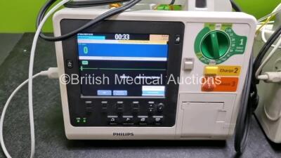 2 x Philips Heartstart XL+ Defibrillators (Both Power Up) Including Pacer, ECG and Printer Options with 2 x Paddle Lead, 2 x 3 Lead ECG Leads and 2 x Batteries - 2