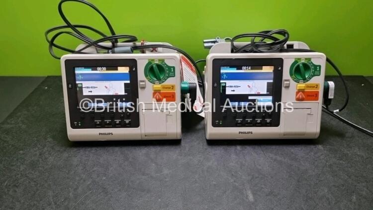 2 x Philips Heartstart XL+ Defibrillators (Both Power Up) Including Pacer, ECG and Printer Options with 2 x Paddle Leads and 2 x Batteries