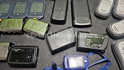 Large Quantity of Various Insulin Pumps and Blood Glucose Monitors (Some Damaged - Some Missing Battery Covers - See Photos) *GH* - 16