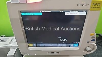 Job Lot Including 1 x Philips IntelliVue MP30 Anesthesia Patient Monitor (Powers Up and 1 x Missing Battery - See Photo) with 1 x Philips IntelliVue X2 Handheld Patient Monitor Including ECG, SpO2, NBP, Temp and Press Options (Powers Up and Damaged Casing - 5