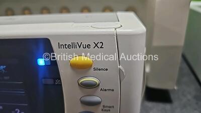 Job Lot Including 1 x Philips IntelliVue MP30 Anesthesia Patient Monitor (Powers Up and 1 x Missing Battery - See Photo) with 1 x Philips IntelliVue X2 Handheld Patient Monitor Including ECG, SpO2, NBP, Temp and Press Options (Powers Up and Damaged Casing - 7