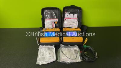 2 x Medtronic Physio Control Lifepak 1000 Defibrillators (Both Power Up) with 1 x ECG Lead, 2 x Electrode Packs (In Date) and 2 x Batteries in Carry Cases