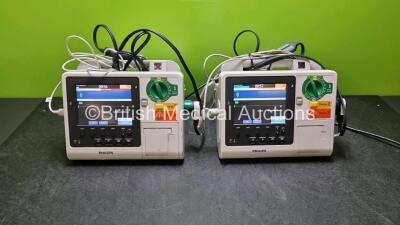 2 x Philips Heartstart XL+ Defibrillators (Both Power Up) Including Pacer, ECG and Printer Options with 2 x Paddle Lead, 2 x 3 Lead ECG Leads and 2 x Batteries