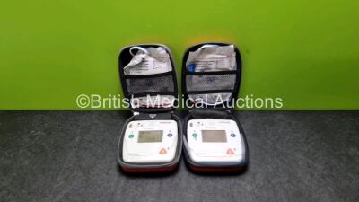 2 x Schiller FRED Easyport Defibrillators (Both Power Up)