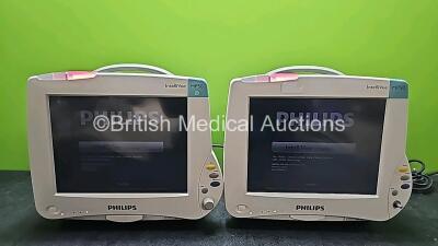 2 x Philips IntelliVue MP50 Touch Screen Patient Monitors (Both Power Up, Both Missing Internal Batteries,1 x Missing Dial and Both Damaged Casings - See Photos)