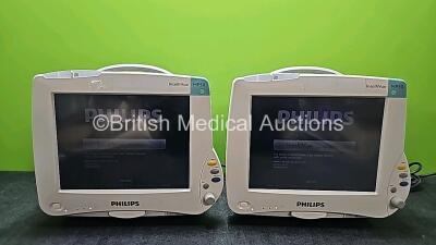 2 x Philips IntelliVue MP50 Touch Screen Patient Monitors (Both Power Up, Both Missing Internal Batteries and Both Damaged Casings - See Photos)