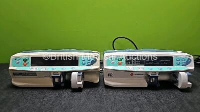 Job Lot Including 1 x CareFusion Alaris PK Syringe Pump (Powers Up) and 1 x Alaris Asena TCI & TIVA PK MK III Syringe Pump ( Draws Power and Damaged Case - See Photo) *SN 800501672 / 800501675* *TUN*