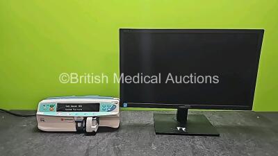 Mixed Lot Including 1 x CareFusion Alaris PK Syringe Pump (Powers Up with Error) and 1 x HANNspree LCD Monitor (Damaged) *SN 9117P3HT01594 / 8005-11422*