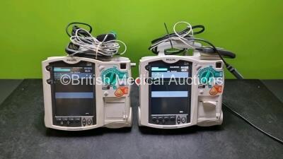 2 x Philips Heartstart MRx Defibrillators (Both Power Up) Including Pacer ,ECG, C02 and Printer Options with 2 x Paddle Leads, 2 x Philips M3725A Test Loads, 2 x Laerdal QCPR Meters, 2 x Philips M3538A Batteries and 2 x Philips M3539A Modules