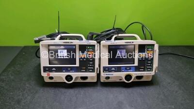 Job Lot Including 1 x Physio Control Medtronic Lifepak 20 Defibrillator / Monitor and 1 x Physio Control Medtronic Lifepak 20e Defibrillator / Monitor (Both Power Up) Including Pacer, ECG and Printer Options with 2 x Paddle Lead and 2 x 3 Lead ECG Leads