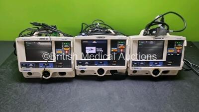 3 x Physio Control Medtronic Lifepak 20 Defibrillators / Monitors (All Power Up All Missing Door) Including ECG and Printer Options with 3 x Paddle Lead and 2 x 3 Lead ECG Leads