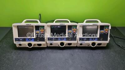 3 x Physio Control Medtronic Lifepak 20 Defibrillators / Monitors (All Power Up All Missing Door) Including ECG and Printer Options with 2 x Paddle Lead