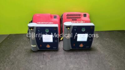 2 x Heartstart FR2+ Defibrillators (Both Power Up) In Case with 2 x Batteries *SN 0204111308 / 0705162253*