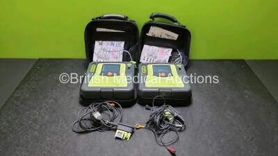 2 x Zoll AED PRO Defibrillators (Both Power Up, 1 x with Scratches on Screen - See Photo) In Carry Case with 2 x 3 Lead ECG Leads, 2 x Batteries and 1 x In Date Electrode Pack