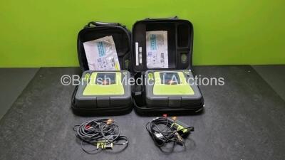 2 x Zoll AED PRO Defibrillators (Both Power Up, 1 x with Scratches on Screen - See Photo) In Carry Case with 2 x 3 Lead ECG Leads, 2 x Batteries and 3 x In Date Electrode Packs