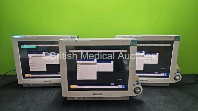 3 x Philips IntelliVue MP70 Patient Monitors (All Power Up and Cracked Cases - See Photos) *SN DE84381720 / DE84380821 / DE84380812*