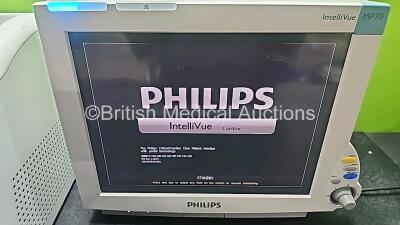 Mixed Lot Including 1 x Hologic Novasure REF RFC2010 RF Controller Model 10 (Powers Up with System Fault) and 1 x Philips IntelliVue MP70 Patient Monitor (Powers Up and Damaged Module Connector - See Photo) *SN 38868K17D0 / DE843A4221* - 5