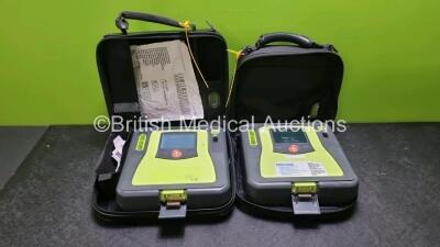 2 x Zoll AED PRO Defibrillators (Both Power Up with Stock Battery Stock Battery Not Included, Both with Light Scratches On Screen) In Carry Case