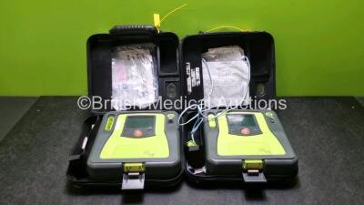 2 x Zoll AED PRO Defibrillators (Both Power Up with Stock Battery Stock Battery Not Included, Both with Light Scratches On Screen) In Carry Case