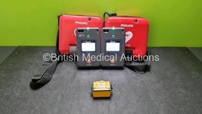 2 x Philips Heartstart FR3 Defibrillators (Both Power Up) In Carry Cases with 2 x Batteries *Install Before - 2025 / 2028* and 3 x In Date Electrode Packs