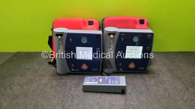 2 x Heartstart FR2+ Defibrillators (Both Power Up) In Case with 3 x Batteries *Install Before - 2021 / 2023 / 2025*