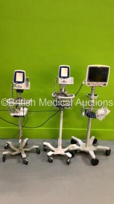 2 x Welch Allyn SPOT Vital Signs LXi Monitors on Stands and 1 x GE DASH 5000 Patient Monitor on Stand with BP1/3, BP 2/4, SPO2, Temp/Co, NIBP and ECG Options (All Power Up)